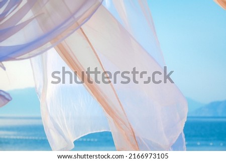 White pergola curtains at seaside as abstract summer holiday background