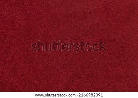 Texture of dark red and wine colors paper background, macro. Structure of dense maroon craft cardboard. Felt backdrop closeup. Royalty-Free Stock Photo #2166982391