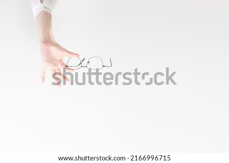 glasses in your hands on a light background. Banner