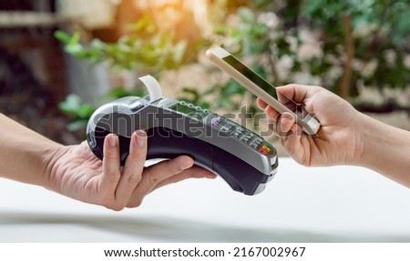 Contactless payment by smartphone. Payment with NFC technology Royalty-Free Stock Photo #2167002967