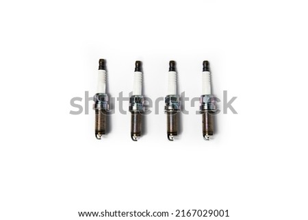 Four car candles on a white background. Top view, flat lay.