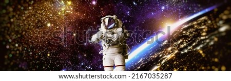 Picture of astronaut spacewalking with glowing stars . Astronaut in outer space. Elements of this image furnished by NASA.