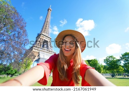 Selfie girl in Paris, France. Young tourist woman taking self portrait with Eiffel Tower in Paris. Royalty-Free Stock Photo #2167061949