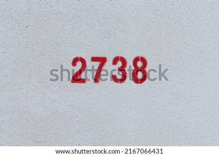Red Number 2738 on the white wall. Spray paint.
 Royalty-Free Stock Photo #2167066431
