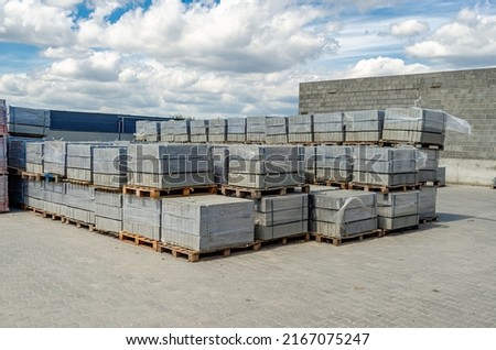 Folded paving slabs, prepared for transportation. Tiles are stacked in pallets. Pavement tile factory.