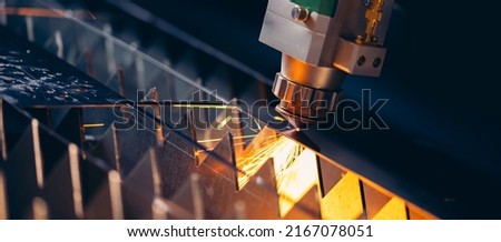 Blue color Laser CNC cut of metal with light spark, technology modern industrial banner. Royalty-Free Stock Photo #2167078051