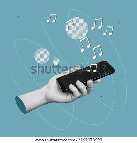 Black blank screen of mobile phone with musical notes symbols in female hand isolated on blue color background. 3d trendy collage in magazine style. Contemporary art. Modern design. Listening to music Royalty-Free Stock Photo #2167078599