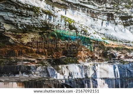 Colored minerals painting the cliff walls of Lake Superior 