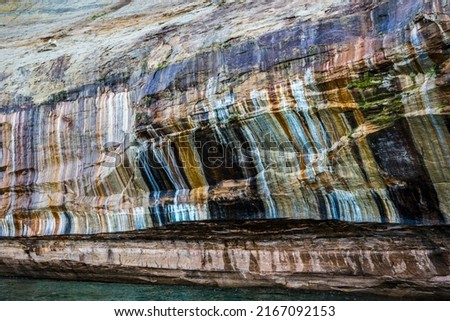 Colored minerals painting the cliff walls of Lake Superior 