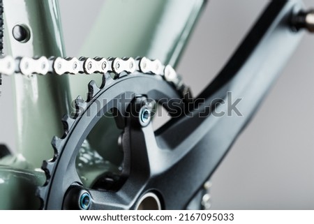 Bicycle crank system with chain close-up, mechanism for repair and tuning Royalty-Free Stock Photo #2167095033