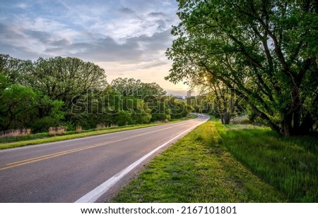 Highway road through the forest at dawn. Highway road in forest Royalty-Free Stock Photo #2167101801