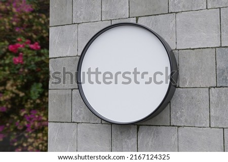 Round Sign Mockup For Logo On The Marble Wall With Blank 3d Sign