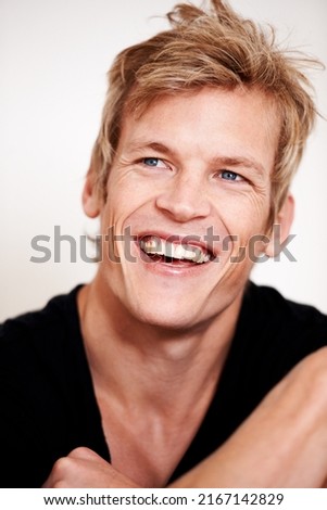 Sensational smile. Cropped shot of a handsome young man posing in studio.