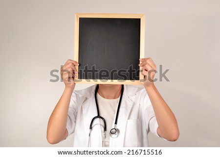 Doctor with blackboard in face