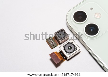 camera modules being used in mobile phones. development of mobile cameras. Digital camera lens part. sensor and technology smartphone new high resolution cameras Royalty-Free Stock Photo #2167174931