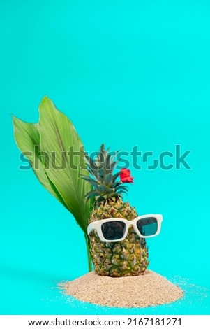 pineapple in a sunglasses  on white background