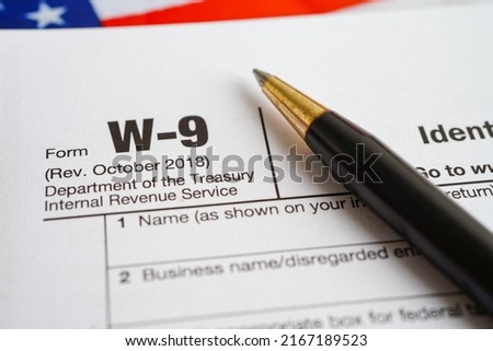 Tax form W-9 Request for Taxpayer Identification Number and Certification, business finance concept. Royalty-Free Stock Photo #2167189523