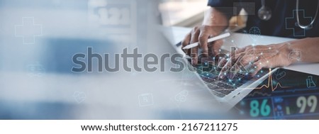 Medical technology network connection concept. Doctor working on laptop computer, health team conference with electronic medical record, health icons on virtual screen interface