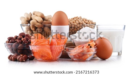 Composition with common food allergens including egg, milk, soya, peanuts, hazelnut, fish, seafood and wheat flour Royalty-Free Stock Photo #2167216373