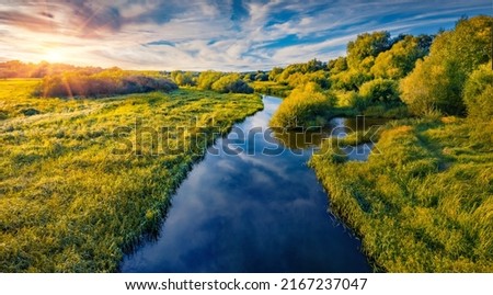 Fresh green scene of Seret river. Amazing outdoor scene of Ukraine countryside. Colorful sunnrise on the river. Beauty of nature concept background.
