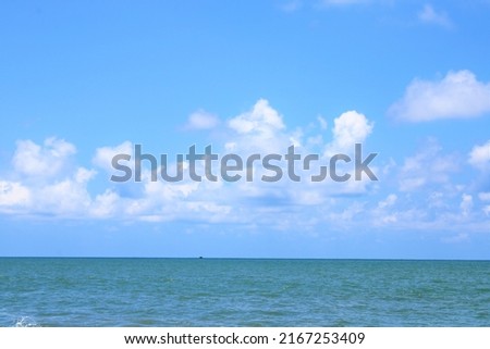 Beautiful sea with blue sky and clouds