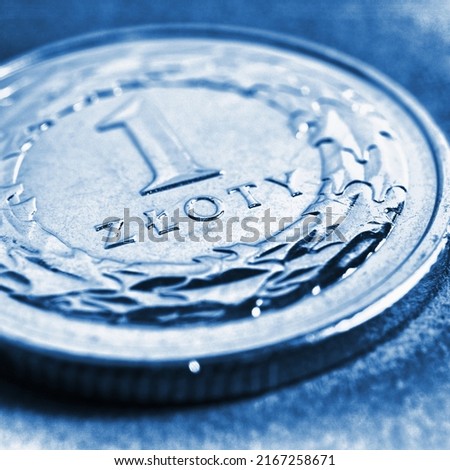 Translation: 1 zloty. Fragment of Polish one zloty coin close-up. National currency of Poland. Blue tinted square illustration for news about economy or finance. Macro