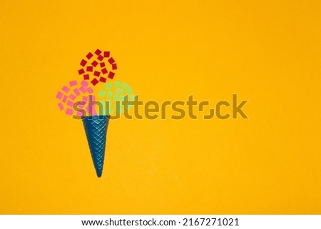 ice cream cone with three colorful paper balls, creative summer concept, copy space
