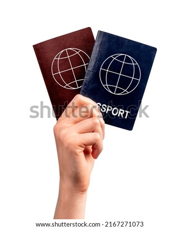 Immigration. Woman hand holding two passports isolated on white background. Multiple, dual nationality, change of citizenship, residency status. High quality photo Royalty-Free Stock Photo #2167271073