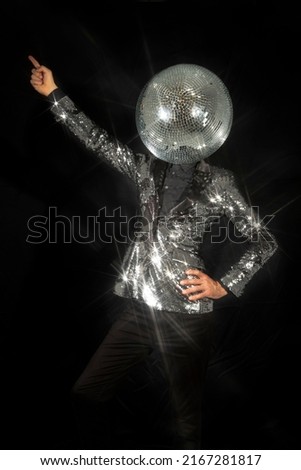 Mr discoball with a mirror bal as a head in nightclub dancing against a black background Royalty-Free Stock Photo #2167281817