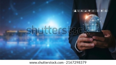 Hand of businessman holding mobilephone with global internet connection application technology and digital marketing, Financial and banking, Digital link tech, big data. business concept Royalty-Free Stock Photo #2167298379