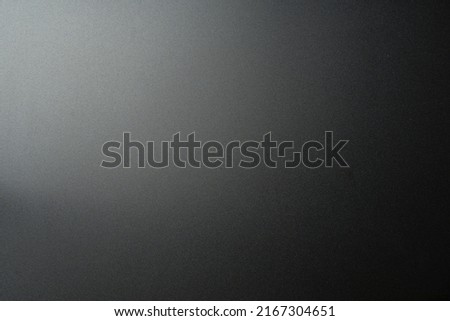 Black matte plastic background with texture and lighting. Royalty-Free Stock Photo #2167304651