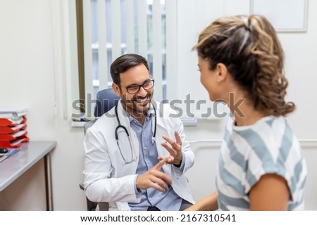 Young male professional doctor physician consulting patient, talking to adult woman client at medical checkup visit. diseases treatment. medical health care concept