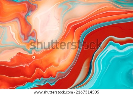 Fluent acrylic background with mixed overflowing paints. Fluid art texture colored waves and swirling forms. An abstract mixture of liquid colorants that flows up and down making wavy backdrop.