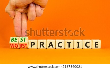 Best or worst practice symbol. Businessman turns wooden cubes and changes words 'worst practice' to 'best practice'. Beautiful orange background. Business, best or worst practice concept. Copy space.