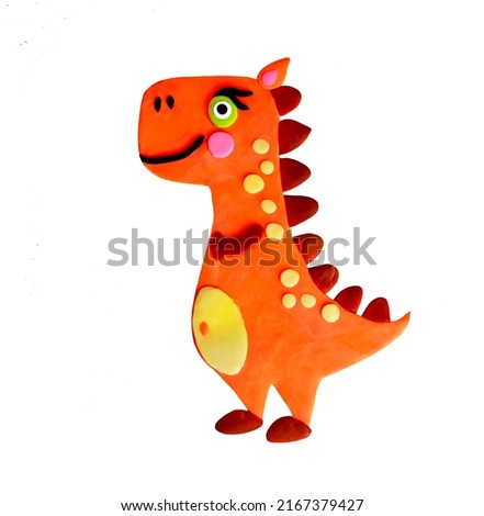 Cute cartoon handmade clay sweet cartoon orange bright lovely adorable dinosaur prehistoric animal predator tyrannosaurus. 