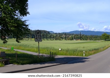 Country road with scenic rural landscape near village Forch, Canton Zürich, on a sunny summer day. Photo taken June 8th, 2022, Forch, Switzerland.