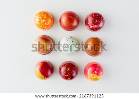 Assortment of painted chocolate pralines. Handcrafted bonbons.Delicious dessert.  Royalty-Free Stock Photo #2167391125