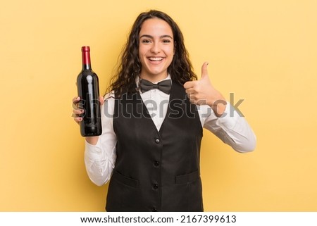 young pretty hispanic woman waiter with a bottle of wine