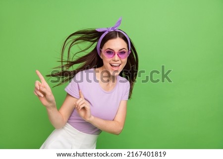 Photo of sweet millennial brunette lady index promo wear band glasses t-shirt isolated on green color background