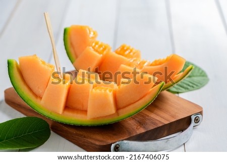 slice of japanese melons, orange melon or cantaloupe melon on white wood background, summer fruits Royalty-Free Stock Photo #2167406075