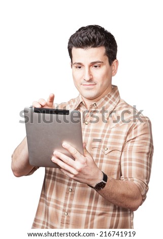 Handsome young man using tablet computer isolated on white background