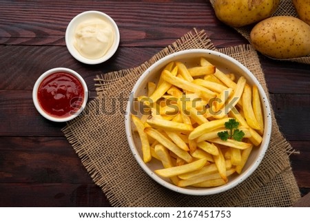 Air Fryer Roast Potatoes on white plate with ketchup and mayo dip.Top view Royalty-Free Stock Photo #2167451753