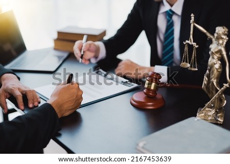 Businessman and lawyer discuss the contract document. Treaty of the law. Sign a contract business. Royalty-Free Stock Photo #2167453639