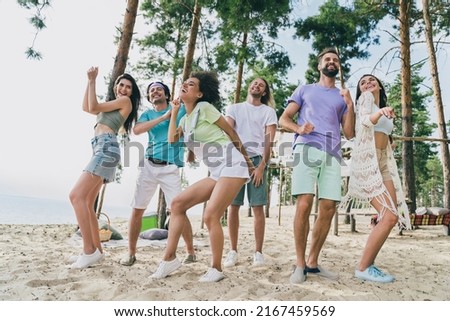 Full length body size view of attractive cheerful carefree glad friends gathering dancing relax time at bank river outdoors