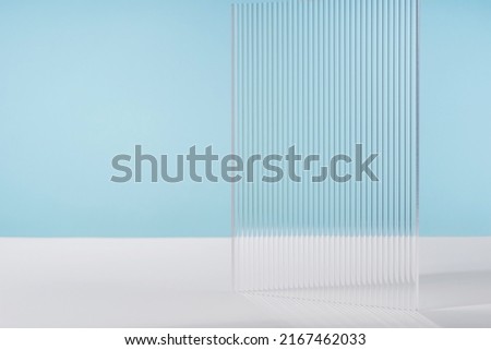 Background for cosmetic product packaging on blue backdrop. Showcase for jewellery presentation, monochrome platform for perfume advertising, cosmetics stand minimal background, branding scene mockup Royalty-Free Stock Photo #2167462033