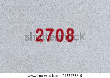Red Number 2708 on the white wall. Spray paint.
 Royalty-Free Stock Photo #2167473915