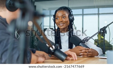 Female Host Talking to a Guest Friend on a Podcast Radio Station in the Studio. African American and European Record Podcast and Discuss Social Issues, Business Radio Show.