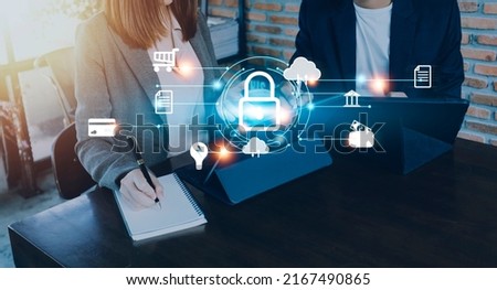Cybersecurity and privacy concepts to protect data. Lock icon and internet network security technology. Businessman protecting personal data on smart phone with virtual screen interfaces.