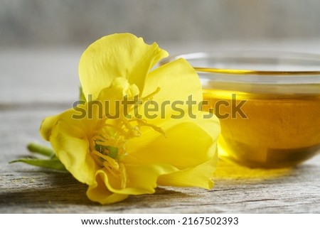 Fresh evening primrose flower and oil Royalty-Free Stock Photo #2167502393