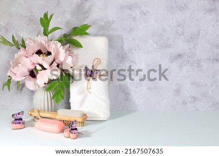 Spa and wellness composition with mountain peony flowers and soap on light background, aromatherapy and skin and body care, lifestyle concept and modern woman,